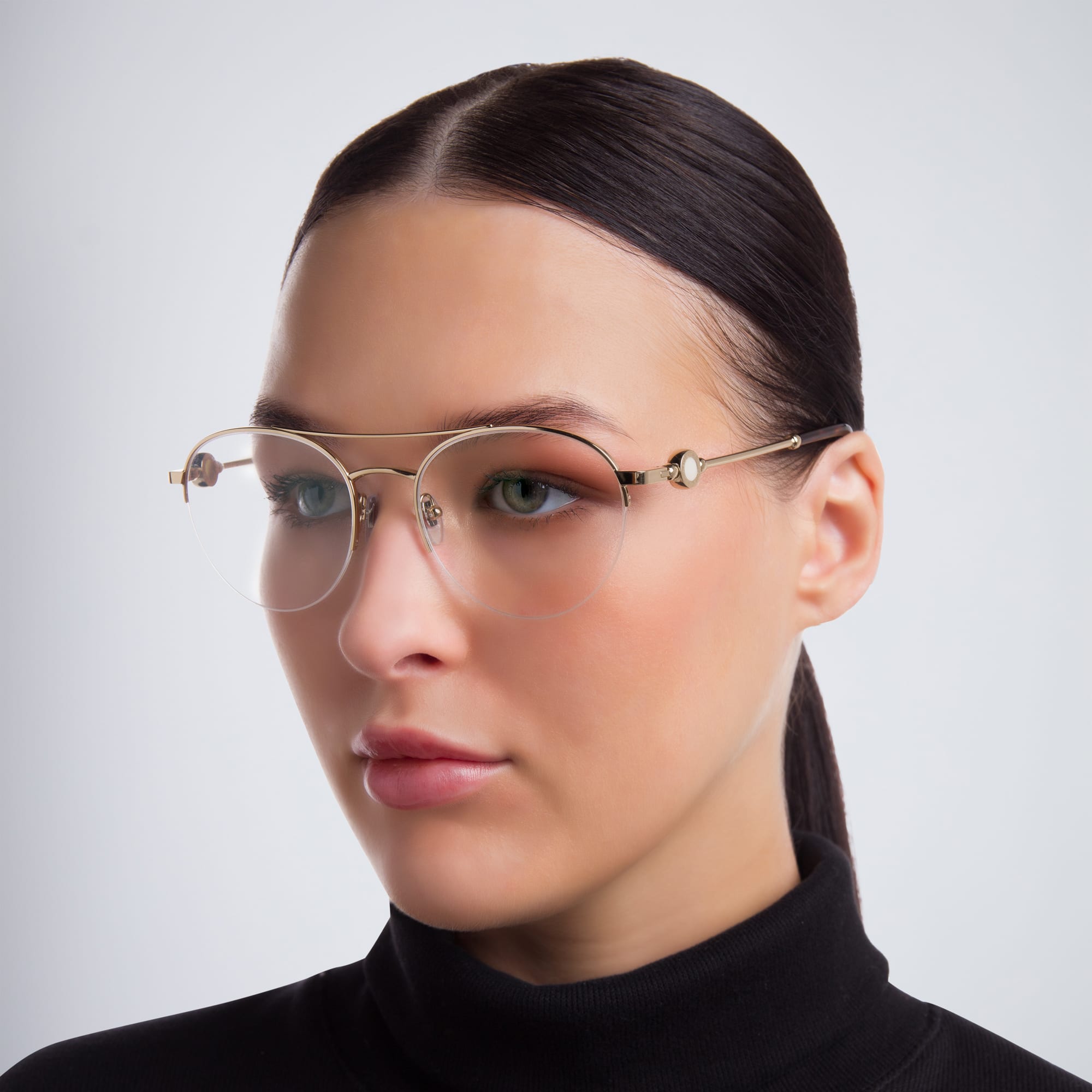 Shop BVLGARI Half Rim Round Eyeglasses in Pale Gold online.