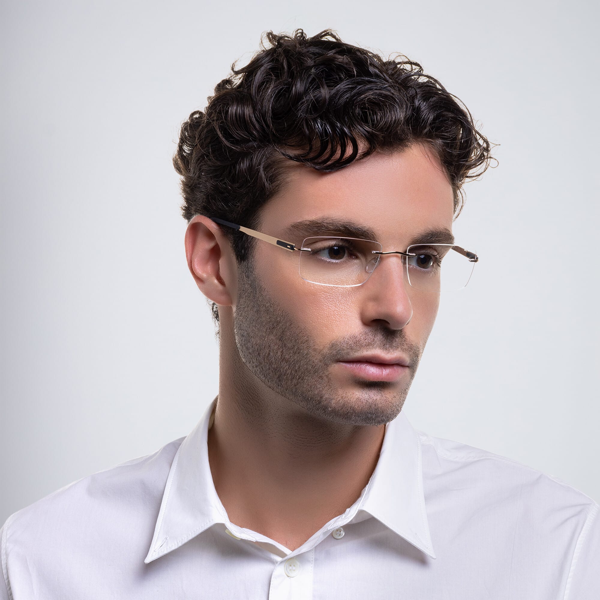 Shop Silhouette Rimless Wide Rectangle Eyeglasses in Gold online.