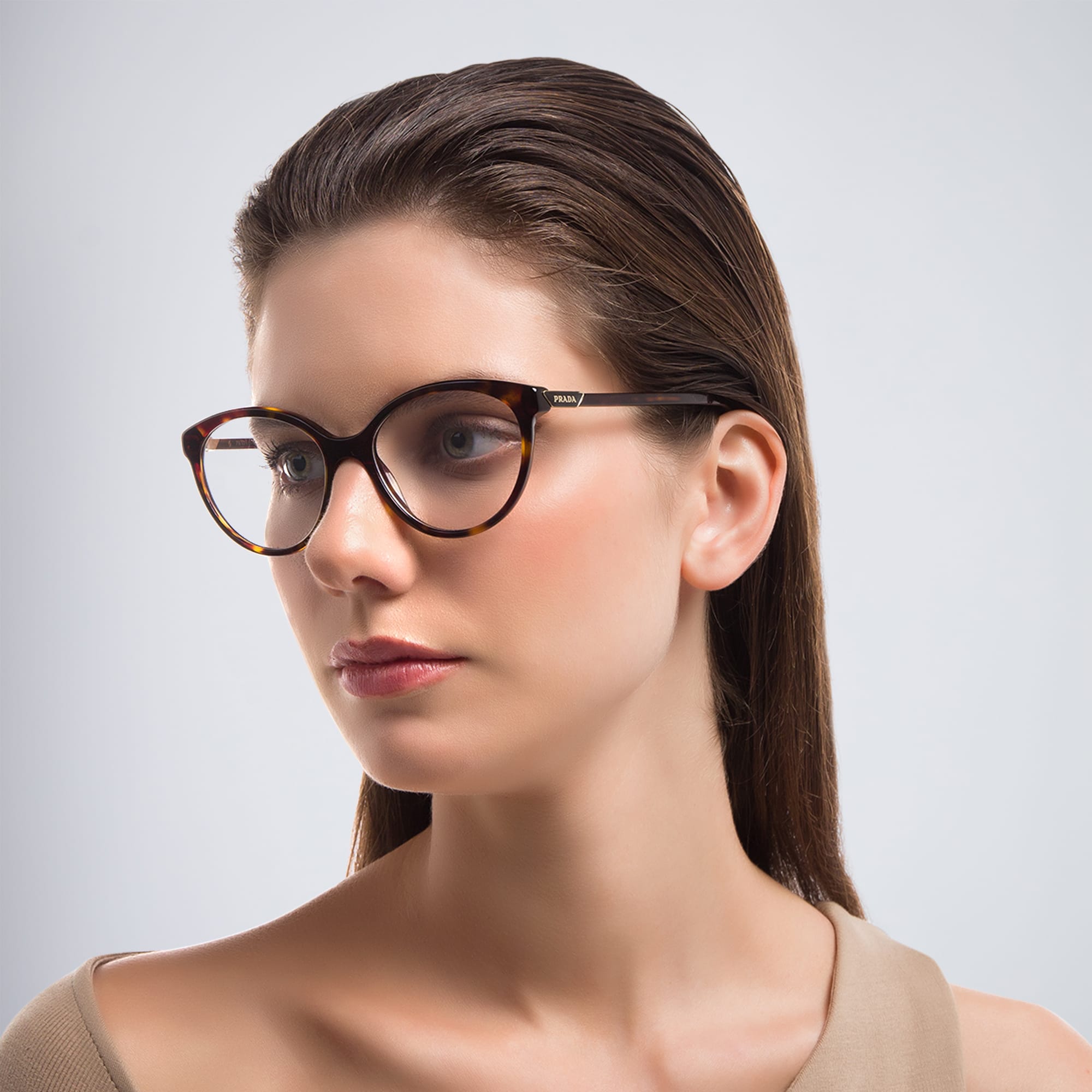 Shop PRADA Round Eyeglasses in Tortoise online.