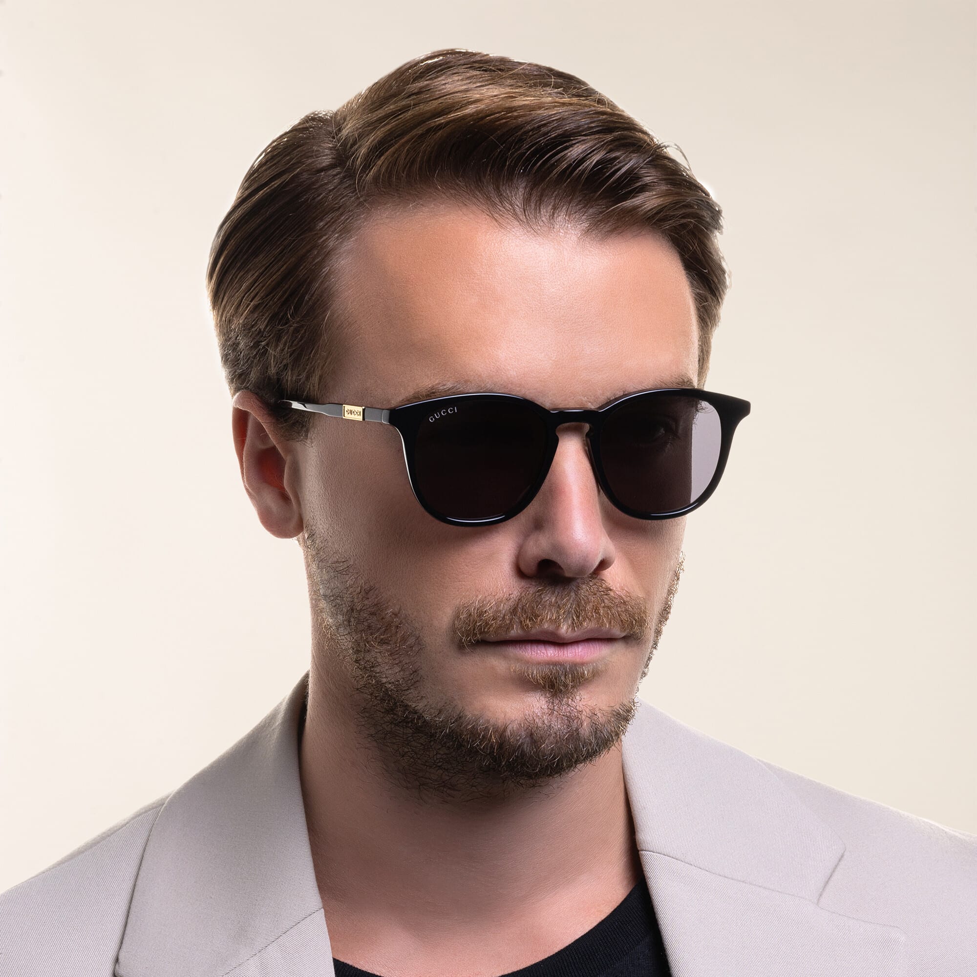 Shop GUCCI Round Sunglasses in Black online.