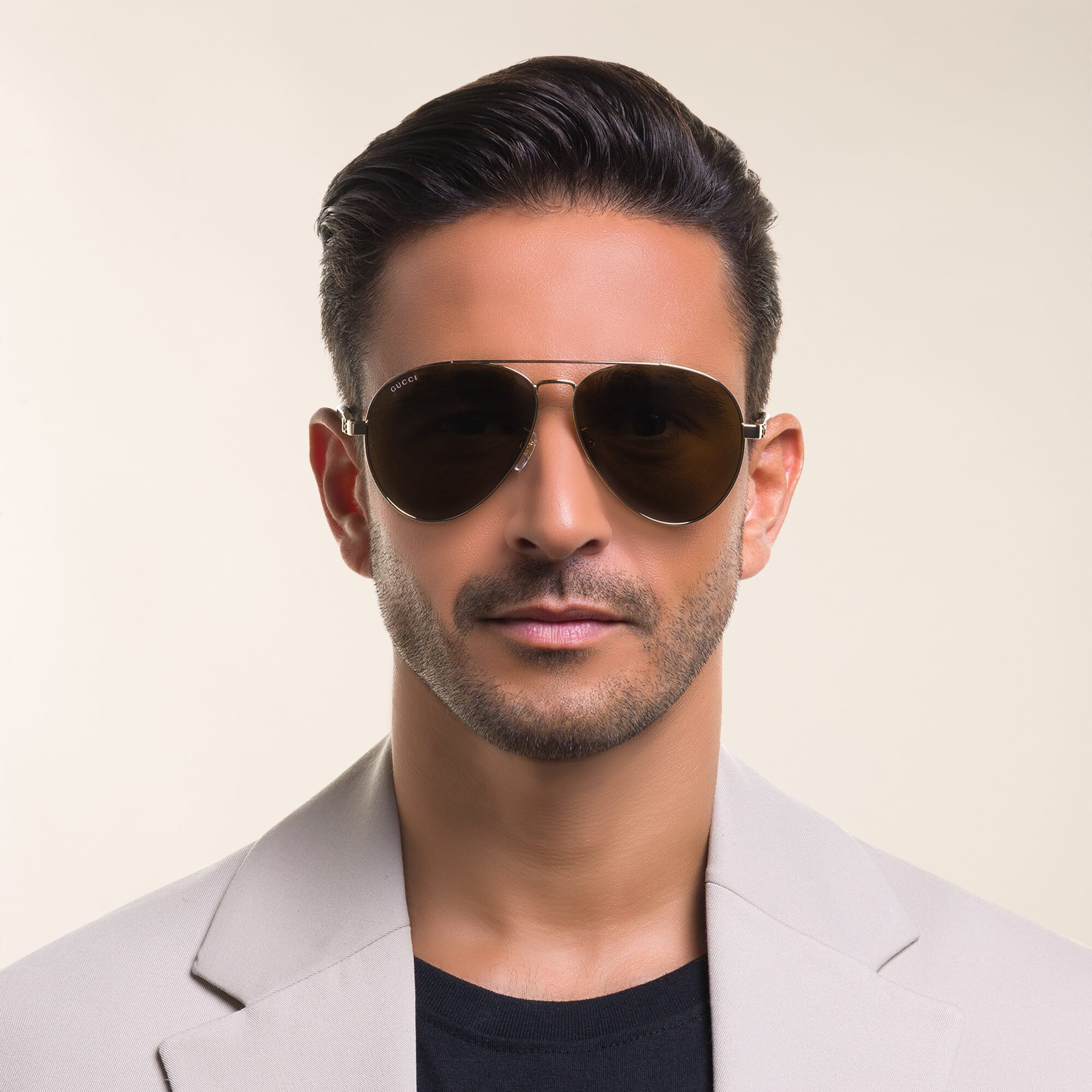 Shop GUCCI Aviator Sunglasses in Gold online.