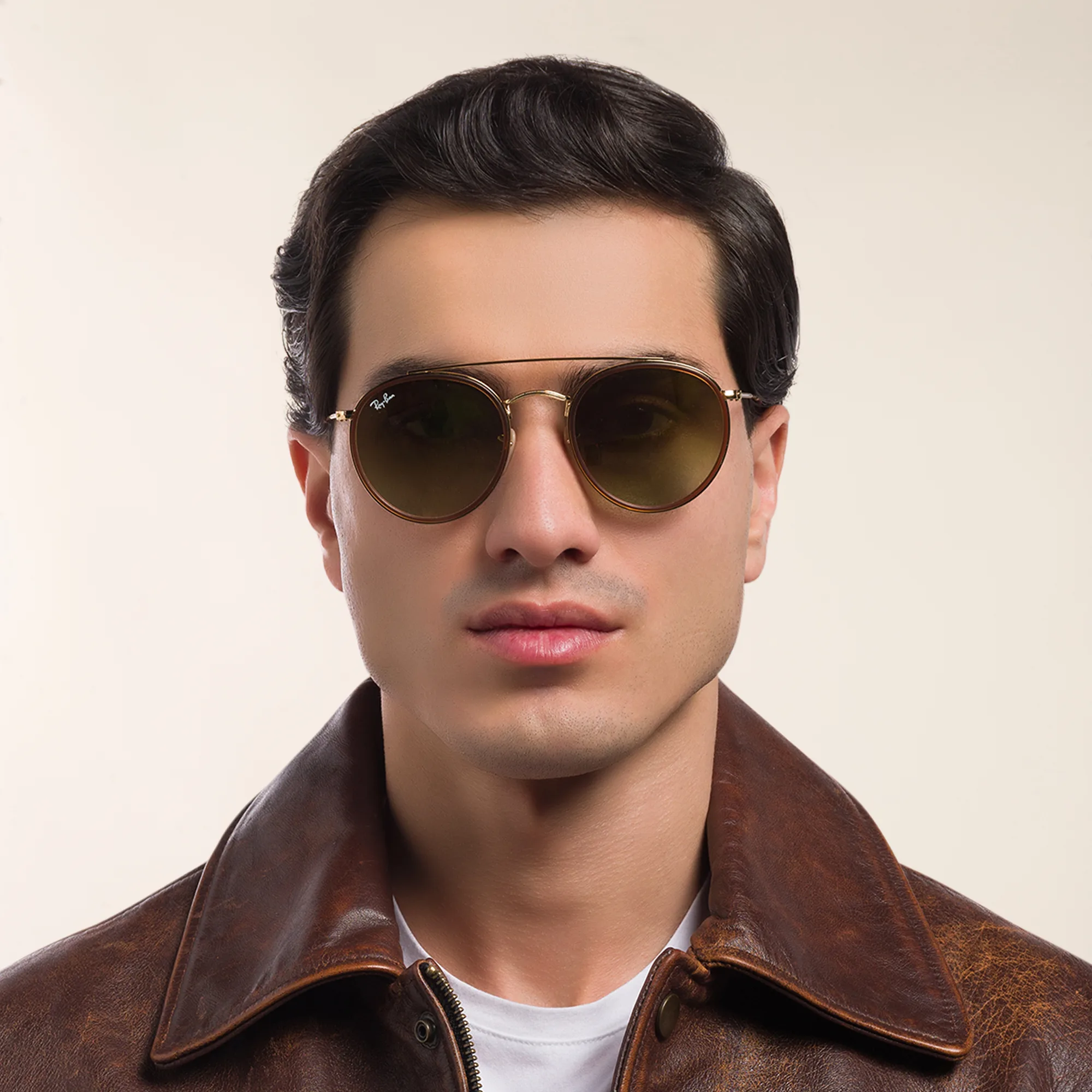 Shop Ray-Ban Round Double Bridge Sunglasses in Gold online.