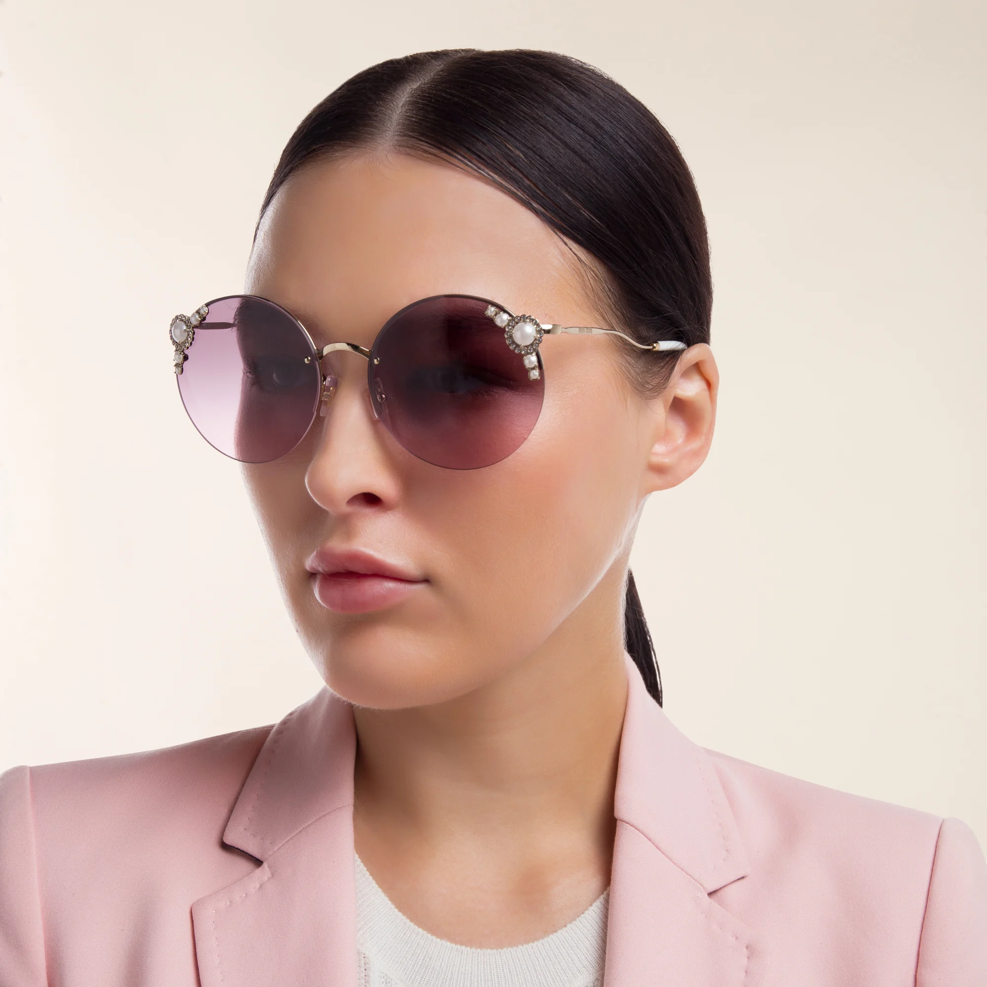 Shop MIU MIU Rimless Round Sunglasses in Pale Gold online.