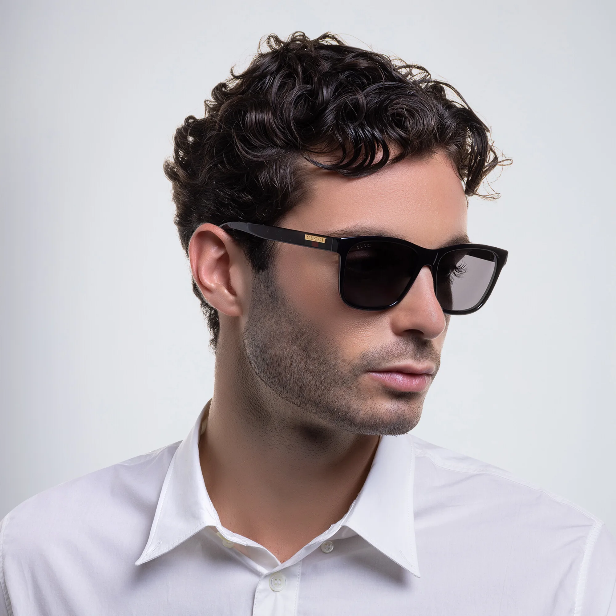 Shop GUCCI Rectangle Sunglasses in Black online.