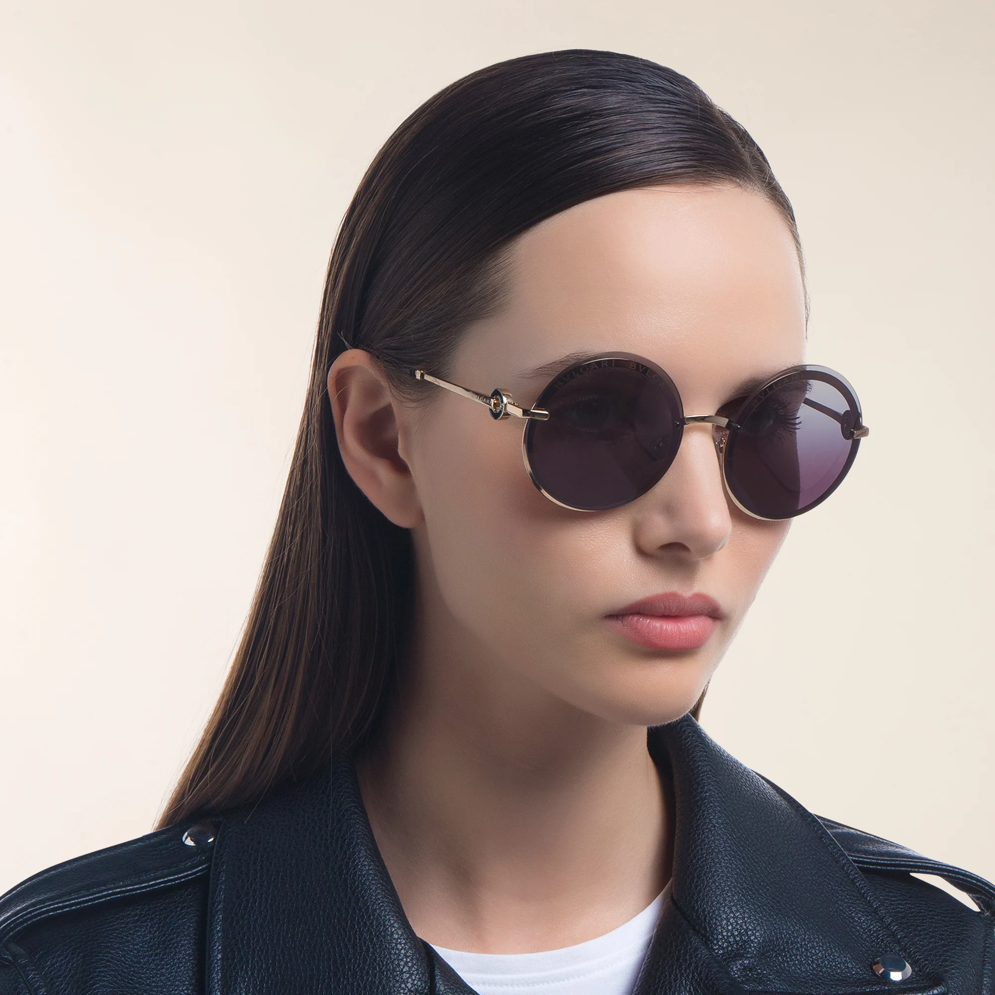 Shop BVLGARI Rimless Round Sunglasses in Pink Gold online.