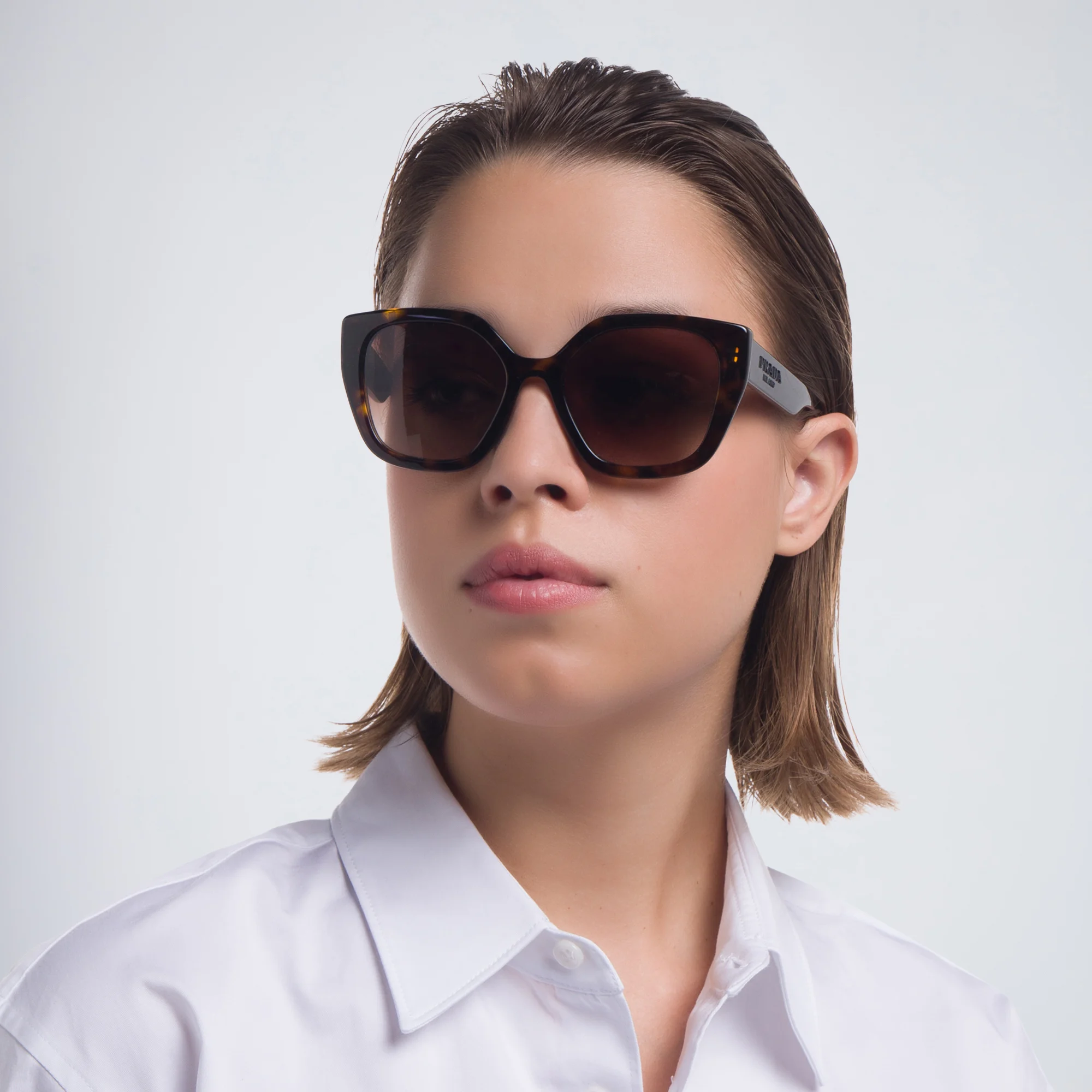 Shop PRADA Cat Eye Sunglasses in Havana online.