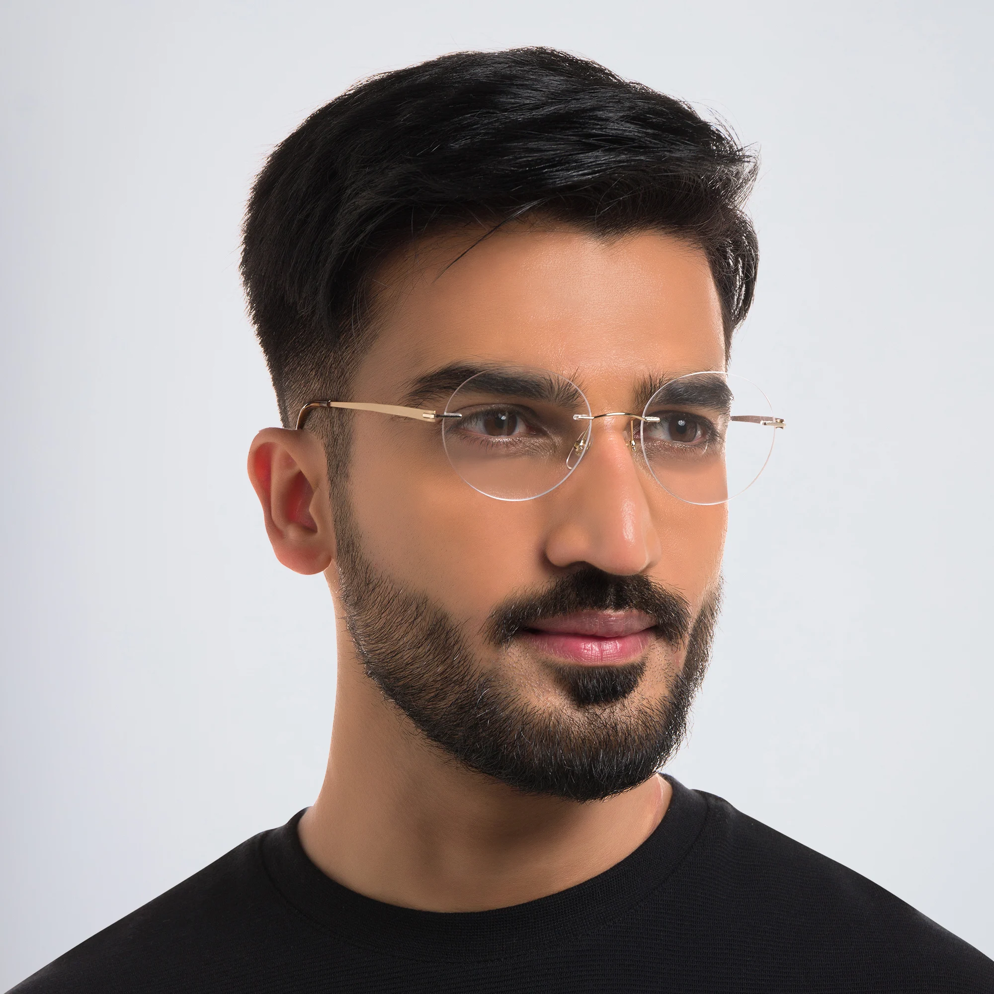 Shop EYE'M Rimless Round Eyeglasses in Gold online.