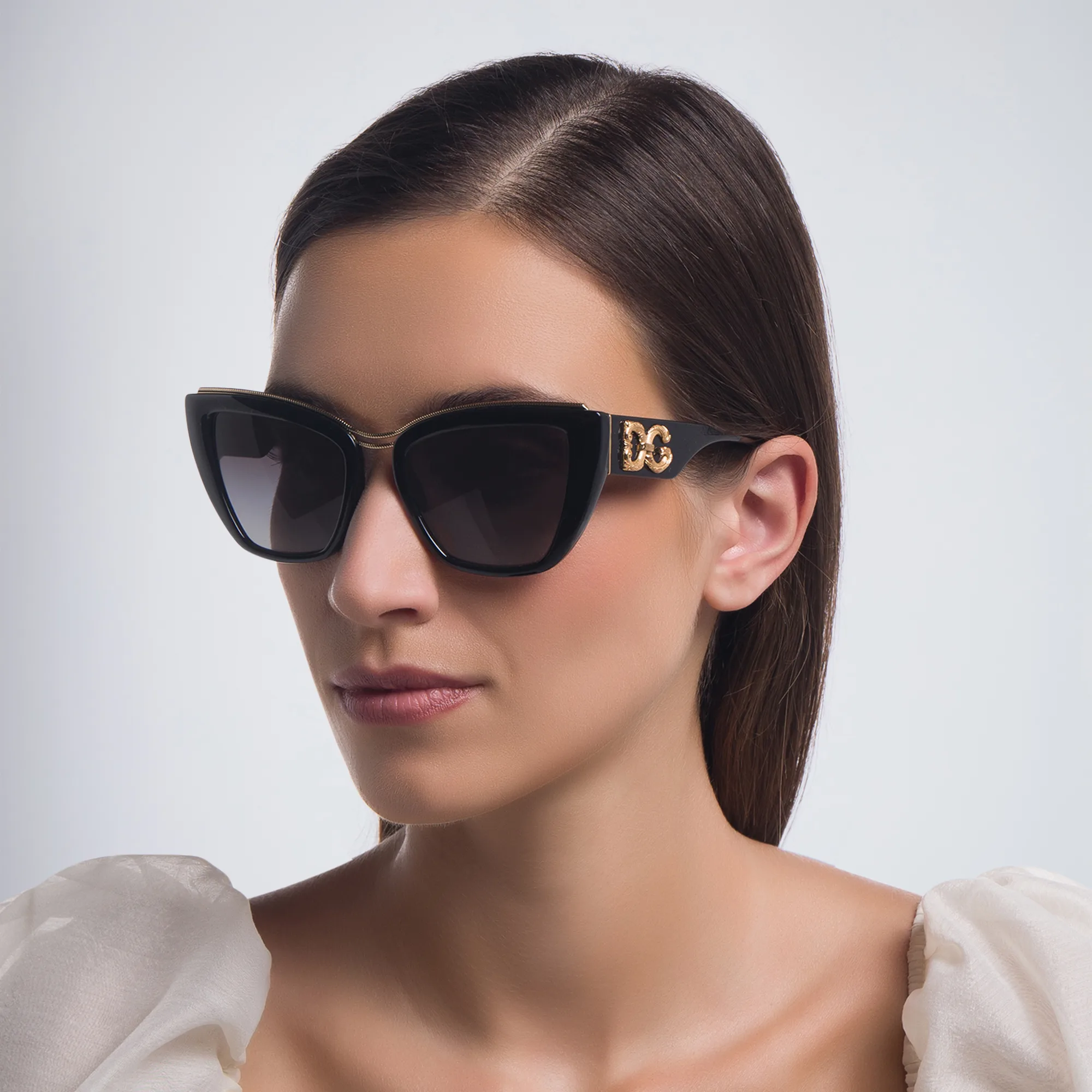 Shop Dolce & Gabbana Cat Eye Sunglasses in Black online.