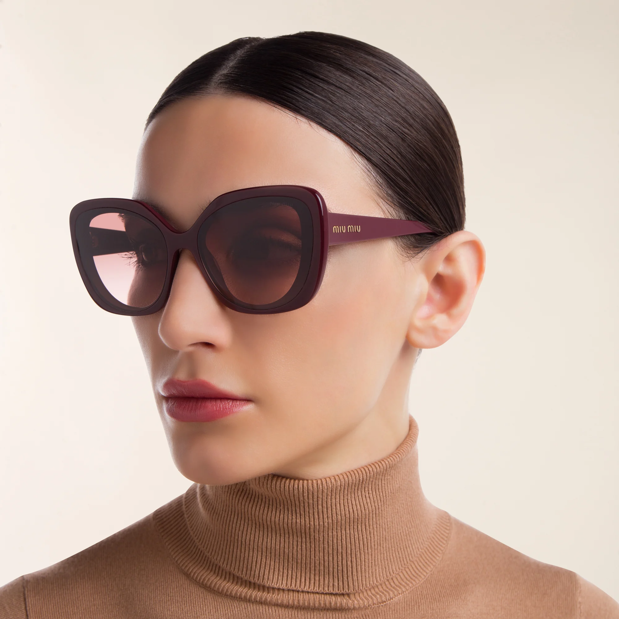 Shop MIU MIU Cat Eye Sunglasses in Pink Bordeaux online.