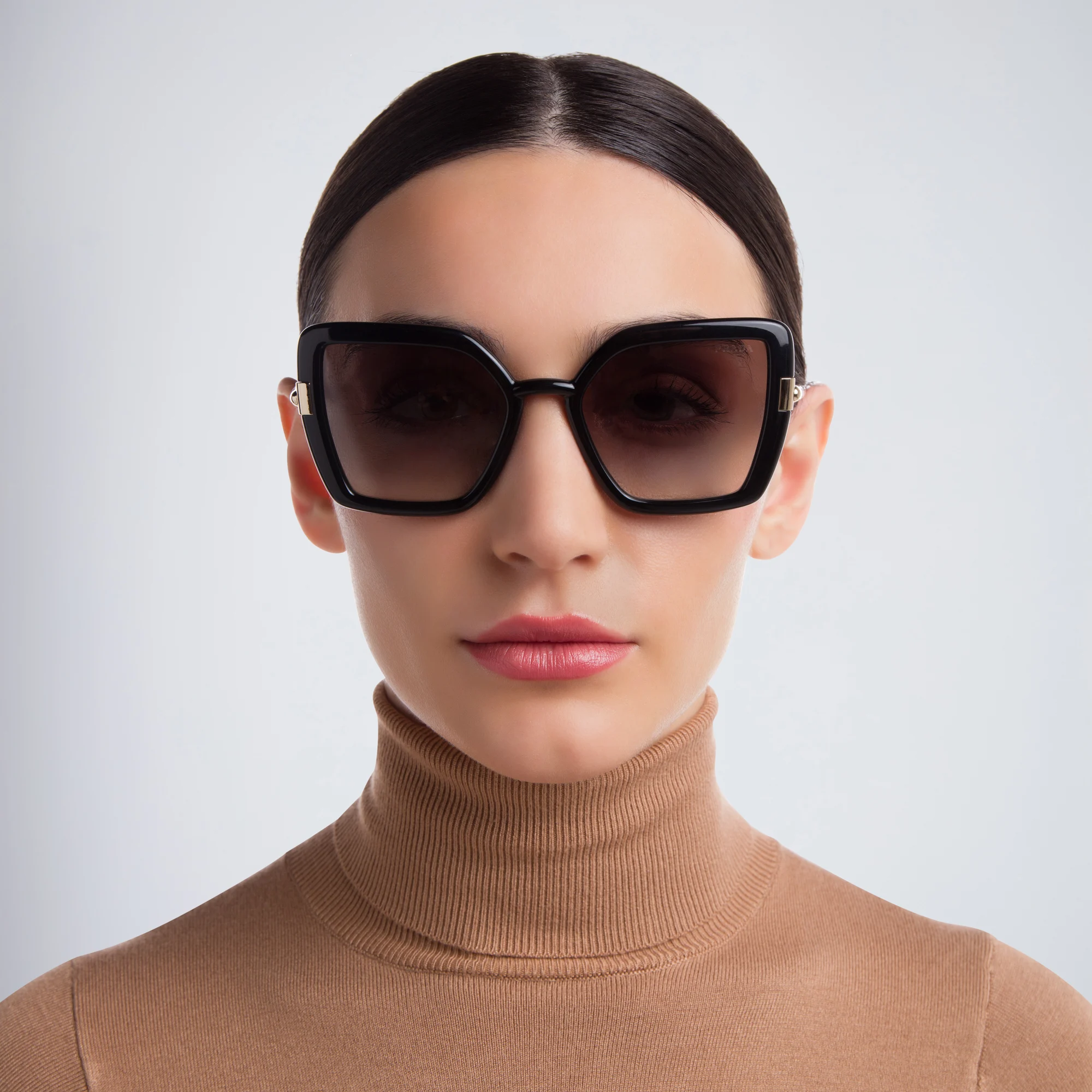 Shop PRADA Cat Eye Sunglasses in Black online.