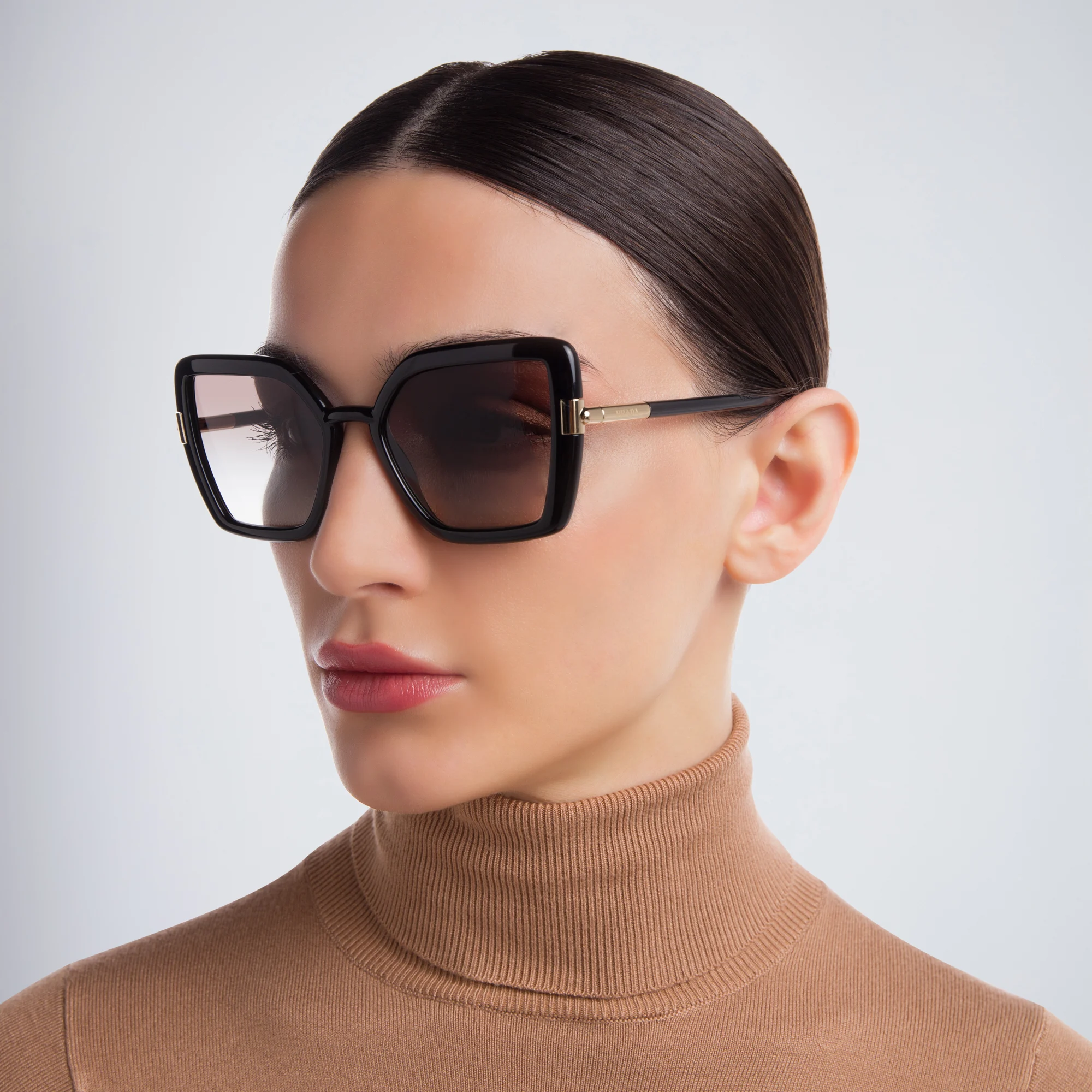 Shop PRADA Cat Eye Sunglasses in Black online.