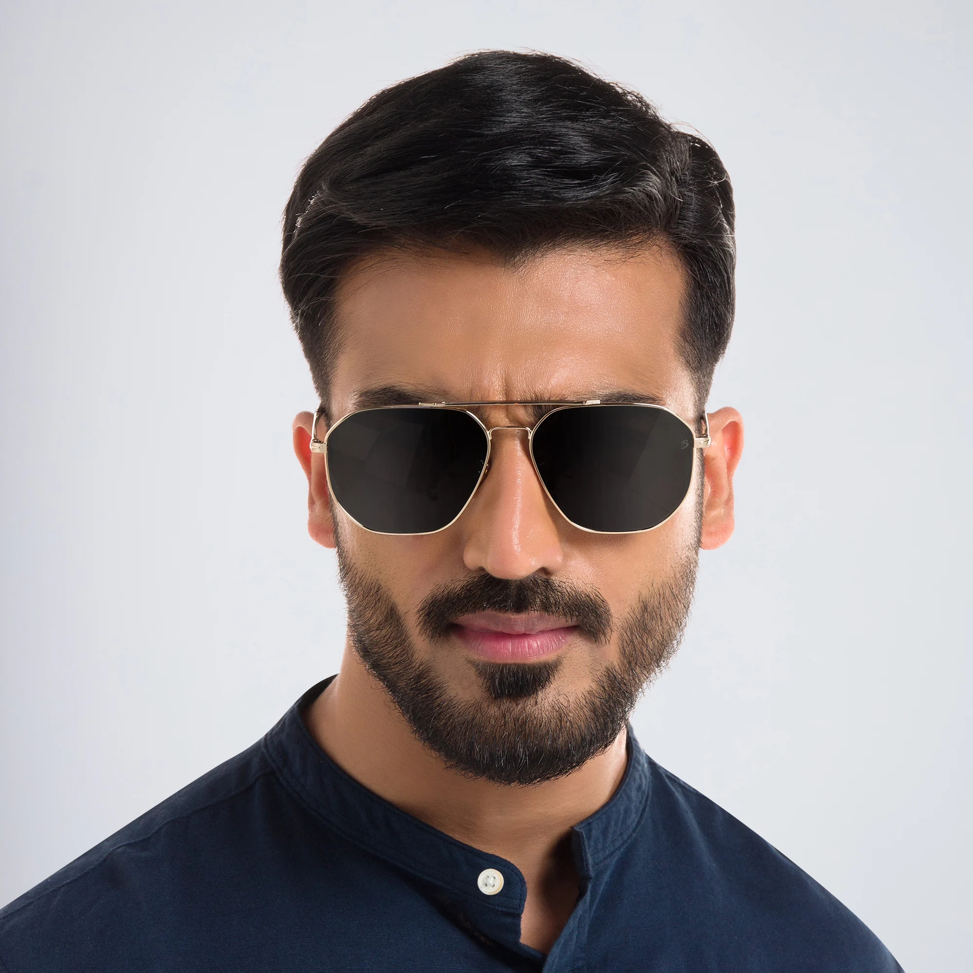 Shop DAVID BECKHAM Pilot Sunglasses in Gold Havana online.