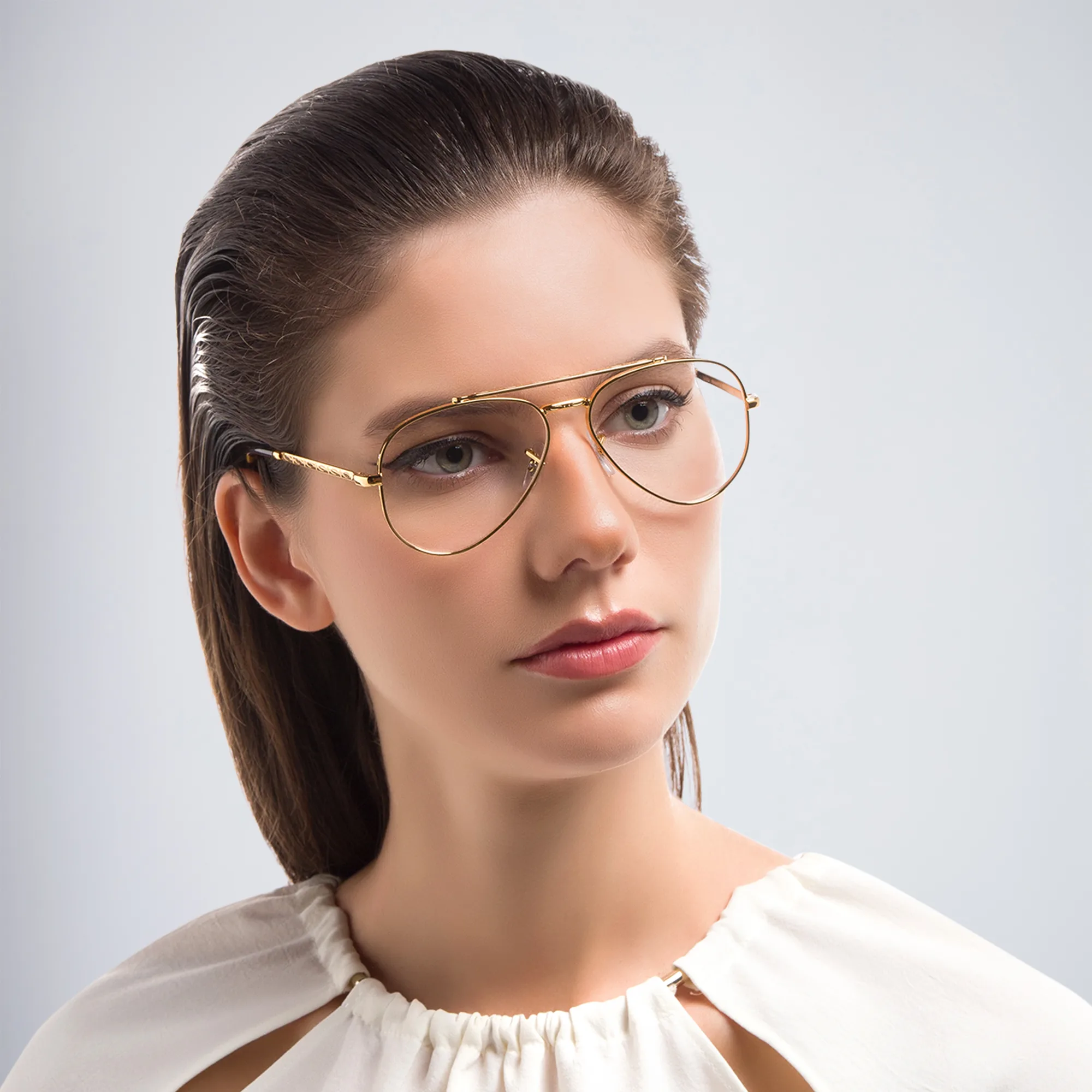 Shop Ray-Ban Unisex Wide Pilot Eyeglasses in Gold online.