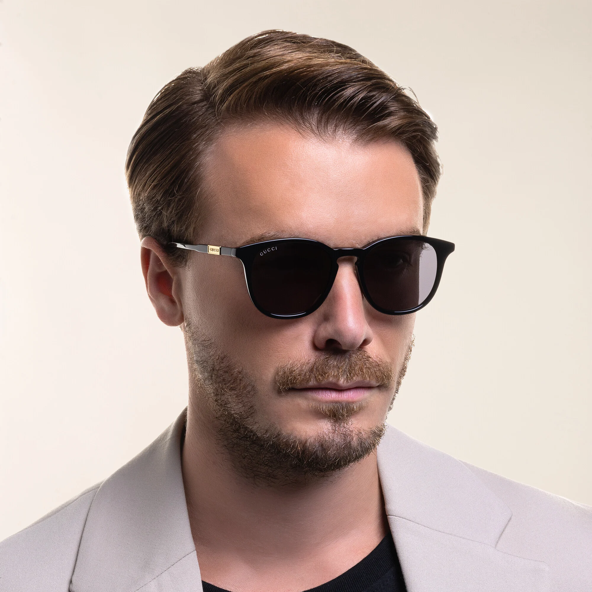 Shop GUCCI Round Sunglasses in Black online.