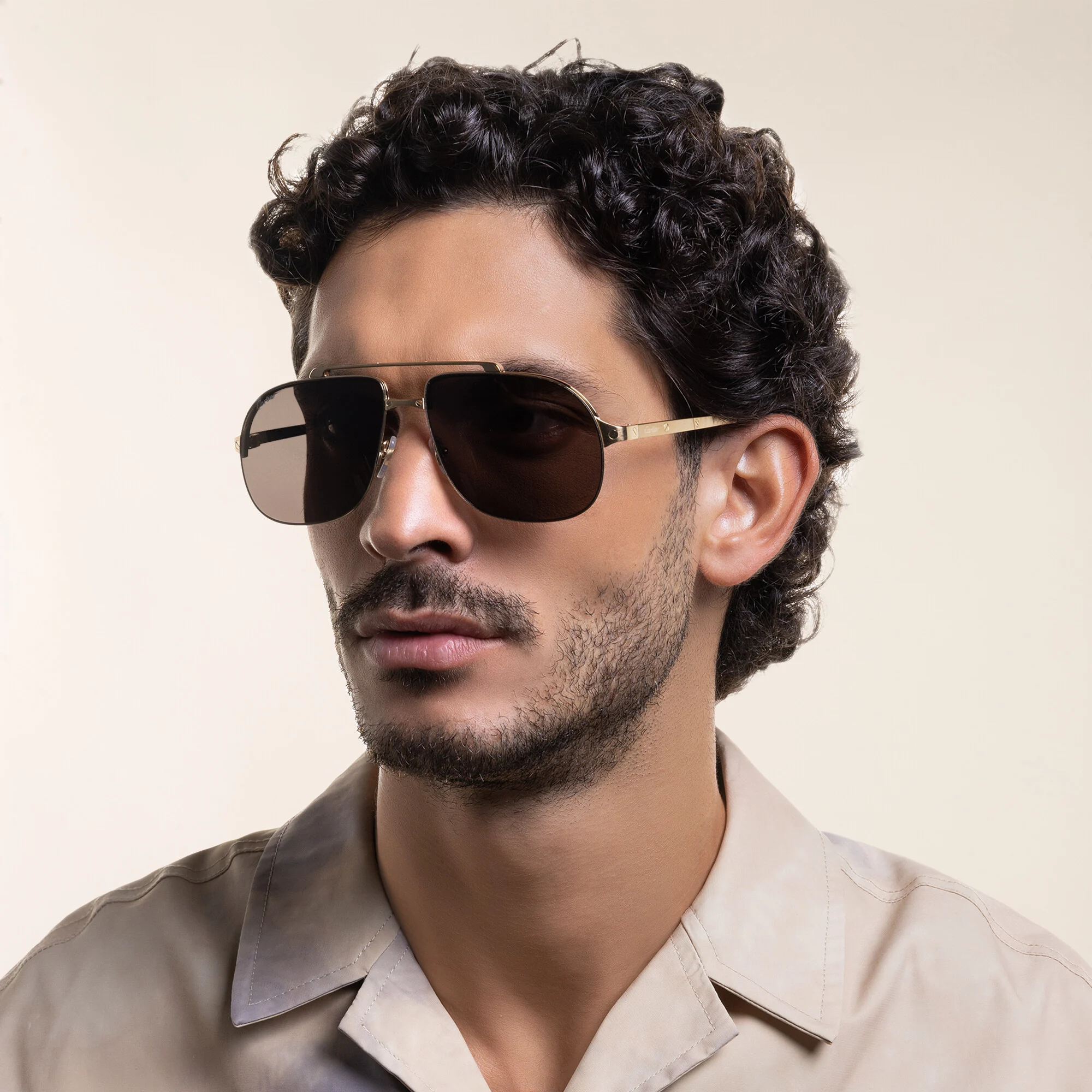 Shop Cartier Santos de Cartier Pilot Sunglasses in Gold online.