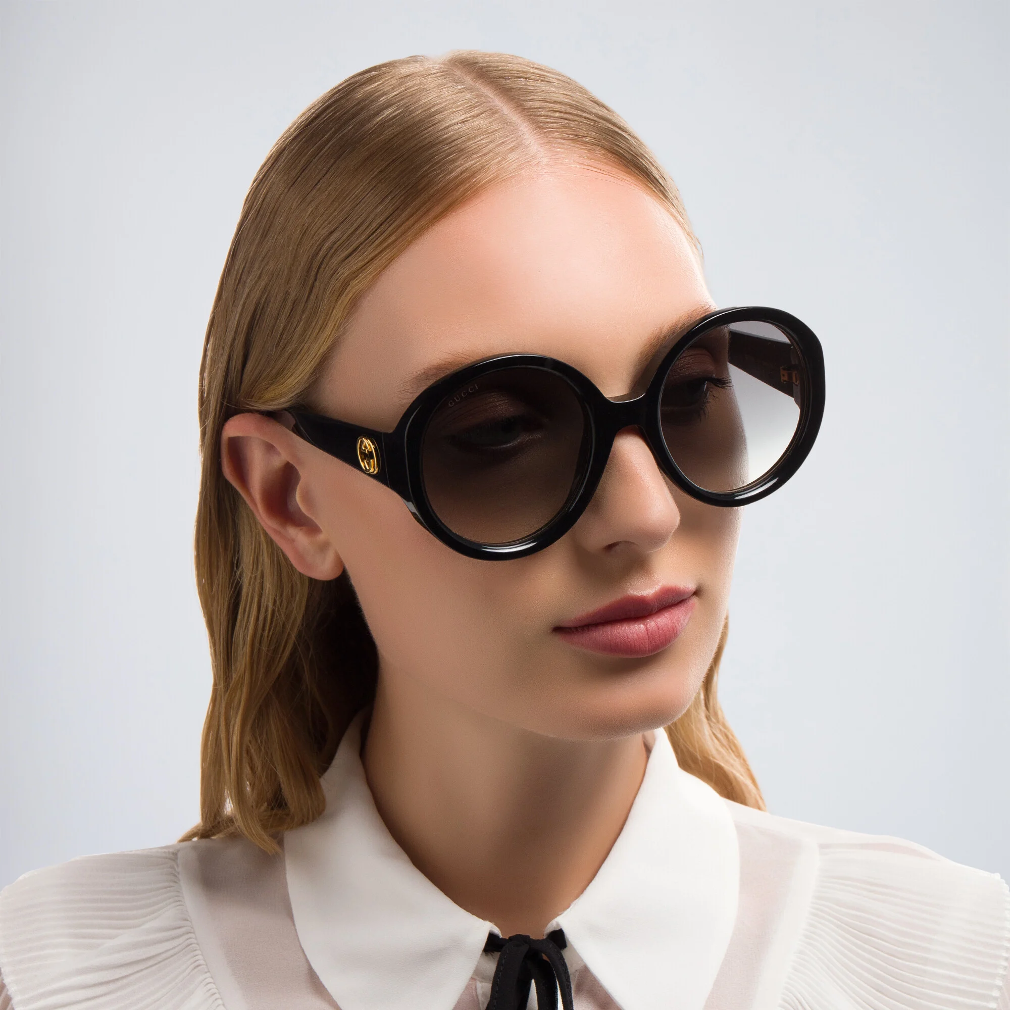 Shop GUCCI Oversized Round Sunglasses in Black online.