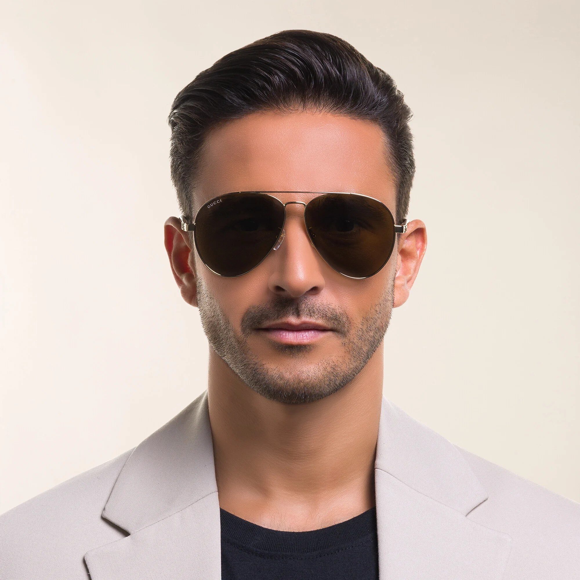 Shop GUCCI Aviator Sunglasses in Gold online.