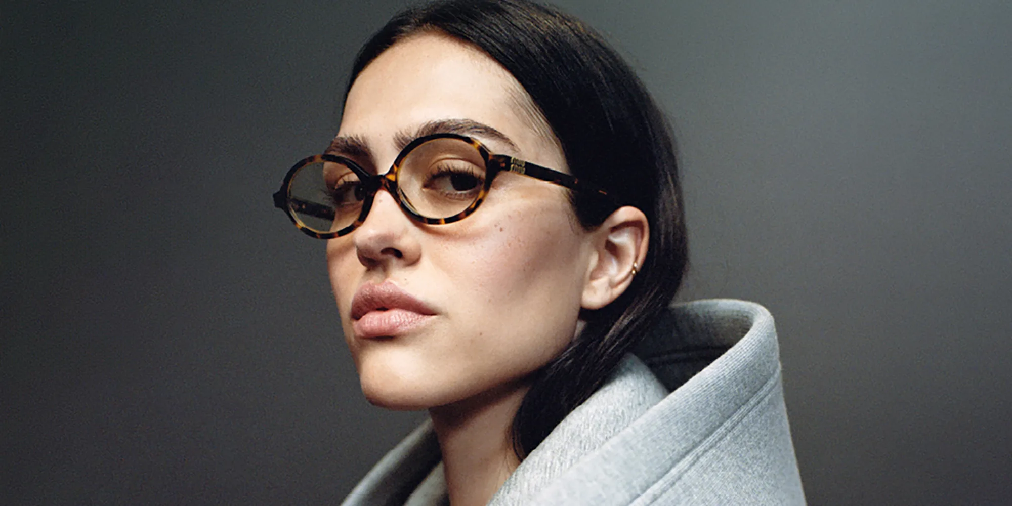 Shop MIU MIU Round Eyeglasses in Honey Havana online.