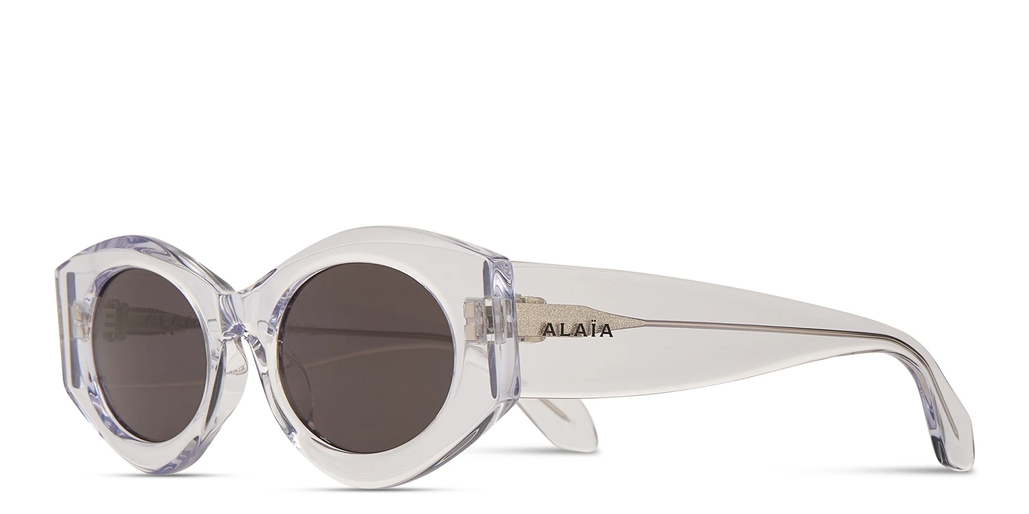 Shop ALAIA Logo Signature Oval Sunglasses in Crystal online.
