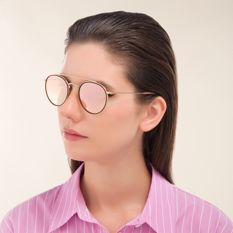 Shop Ray-Ban Round Double Bridge Sunglasses in Gold online.