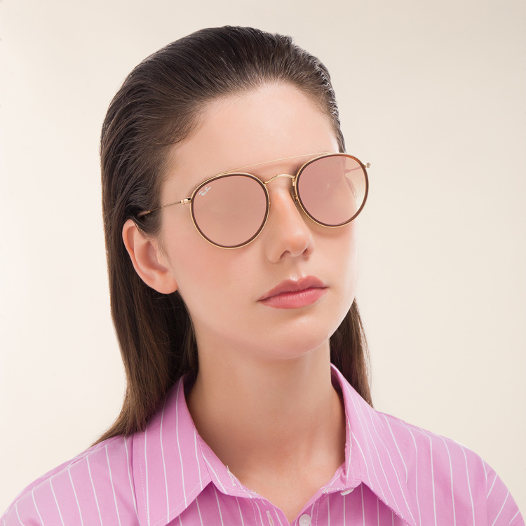 Shop Ray-Ban Round Double Bridge Sunglasses in Gold online.