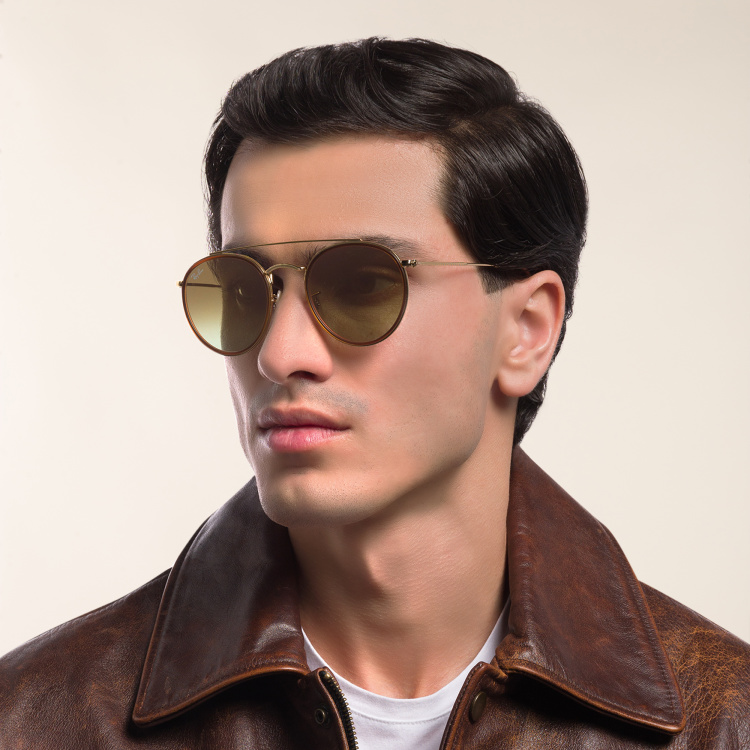 Shop Ray-Ban Round Double Bridge Sunglasses in Gold online.
