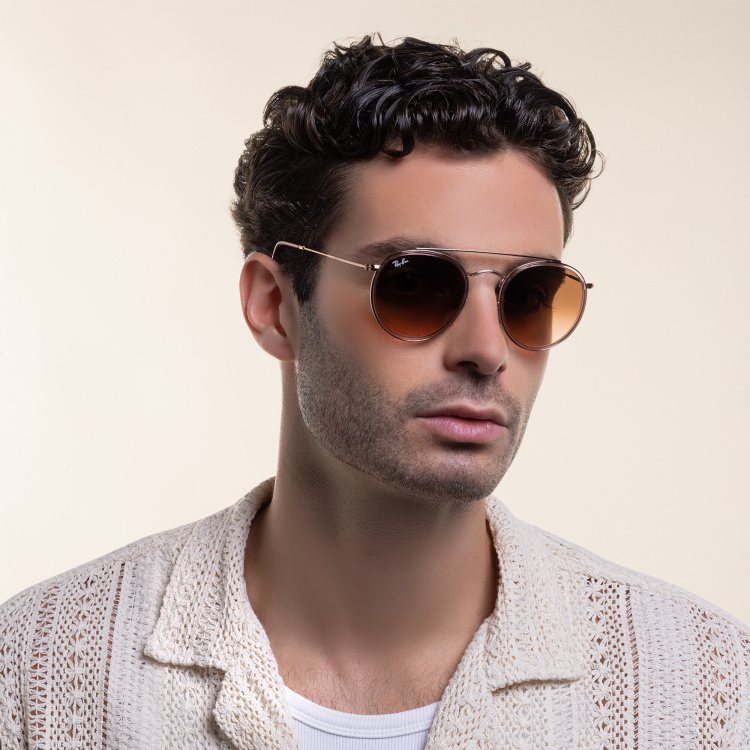 Shop Ray-Ban Round Double Bridge Sunglasses in Copper online.