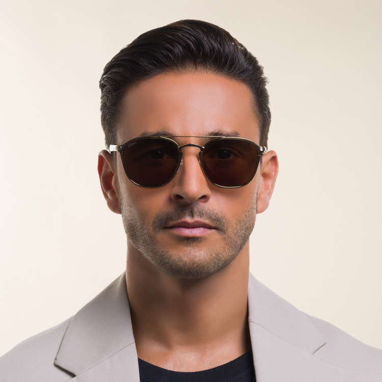 Shop Cartier Signature 'C'de Cartier Unisex Sunglasses in Gold online.