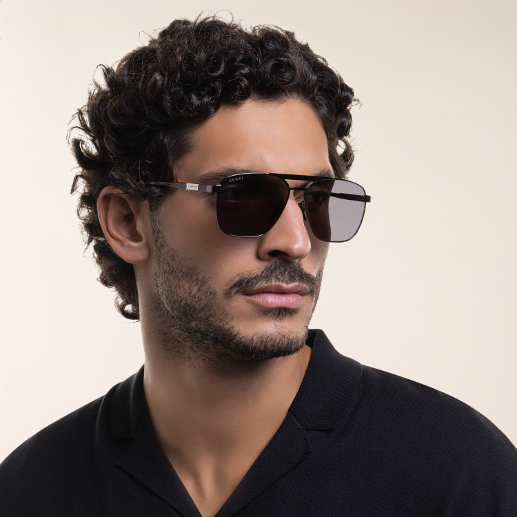 Shop GUCCI Aviator Sunglasses in Grey online.