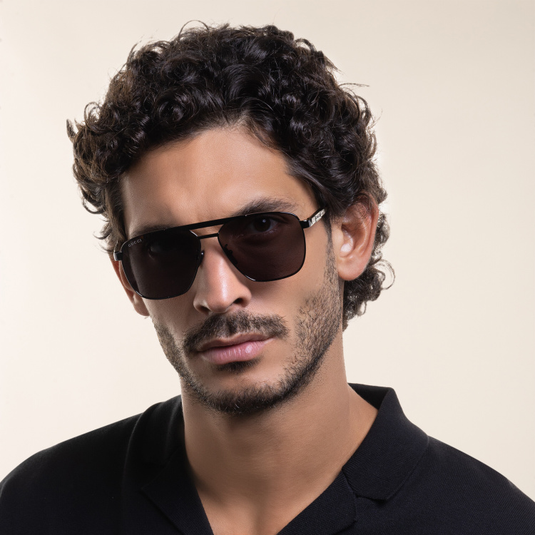 Shop GUCCI Aviator Sunglasses in Grey online.