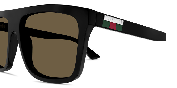 Shop GUCCI Engraved Logo Rectangle Sunglasses in Black online.