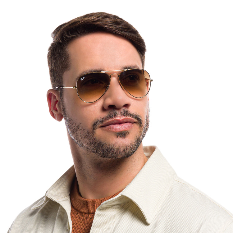 Shop Ray-Ban Pilot Gradient Sunglasses in Gold online.