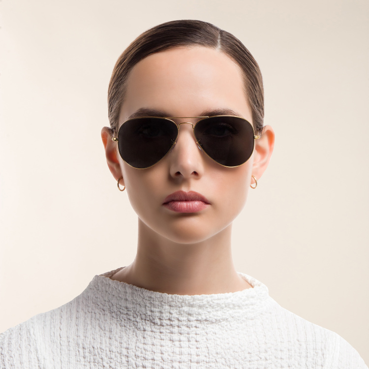 Shop Ray-Ban Unisex Pilot Polarized Sunglasses in Metal in Gold online.