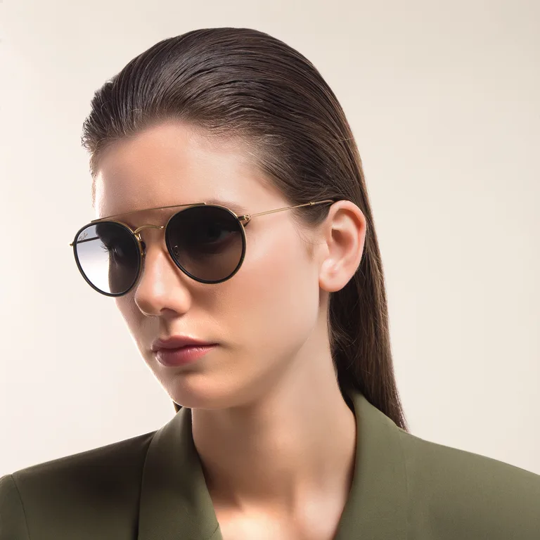 Shop Ray-Ban Unisex Round Sunglasses in Gold online.