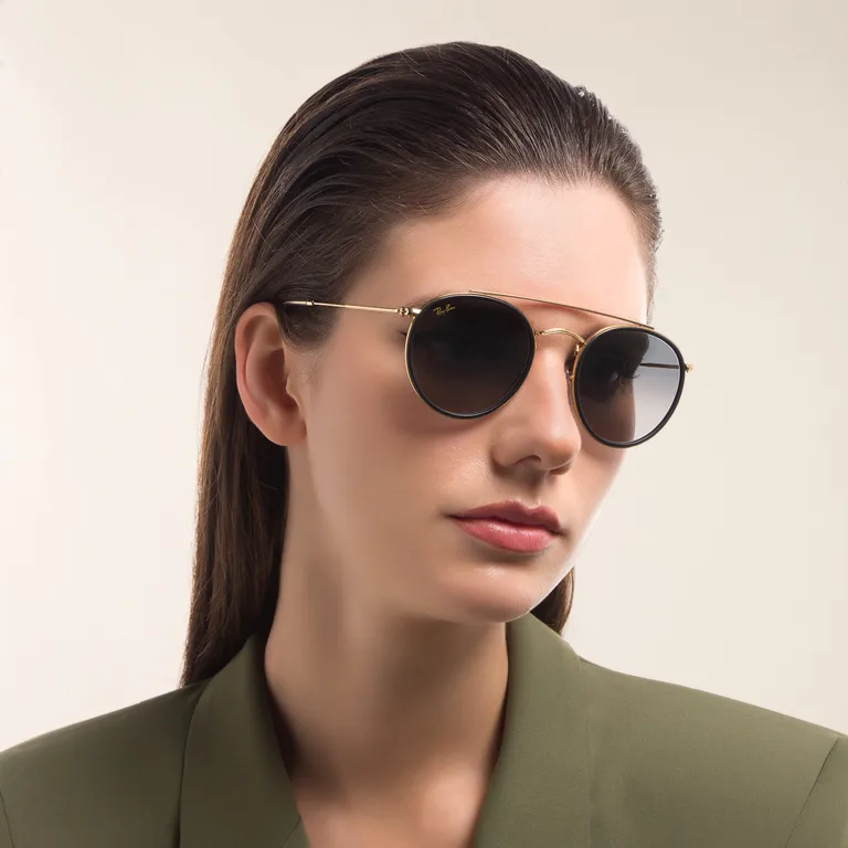 Shop Ray-Ban Unisex Round Sunglasses in Gold online.