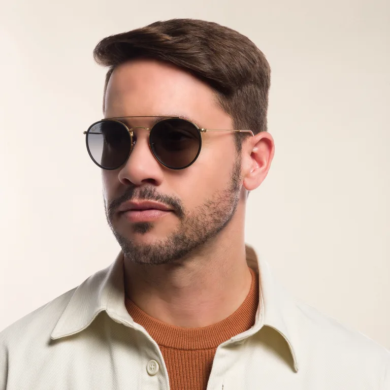 Shop Ray-Ban Unisex Round Sunglasses in Gold online.