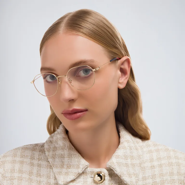 Shop GUCCI Round Eyeglasses in Gold online.