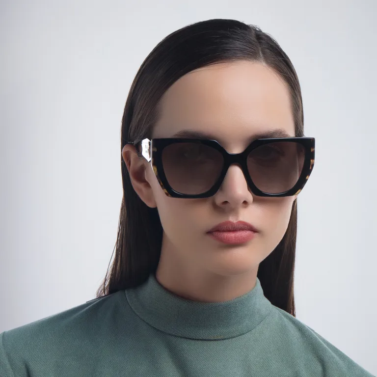 Shop PRADA Rectangle Sunglasses in Black online.