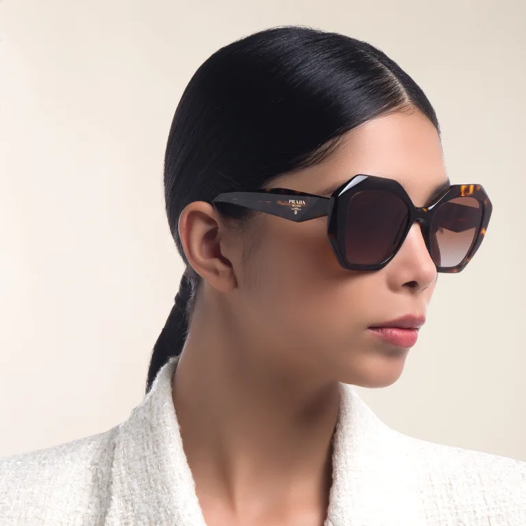 Shop PRADA Irregular Sunglasses in Tortoise online.