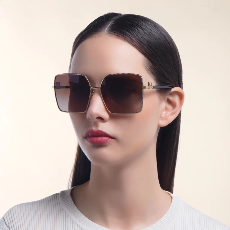 Shop Dolce & Gabbana Oversized Wide Square Sunglasses in Gold online.
