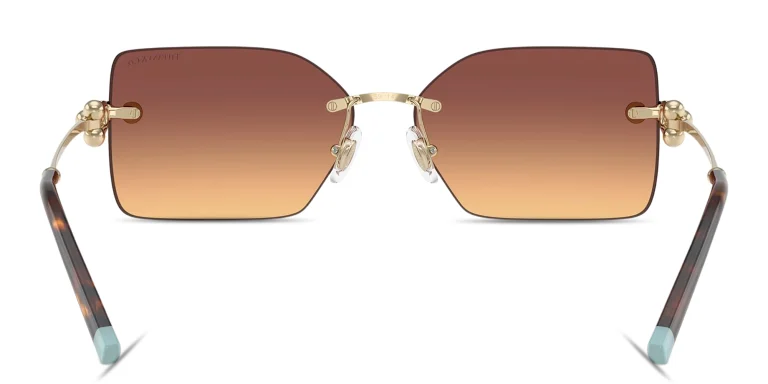 Shop TIFFANY Tiffany HardWear Rimless Rectangle Sunglasses in Gold online.