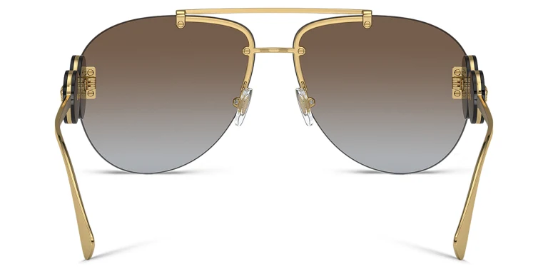 Shop VERSACE Double Medusa rimless Pilot sunglasses in Gold online.