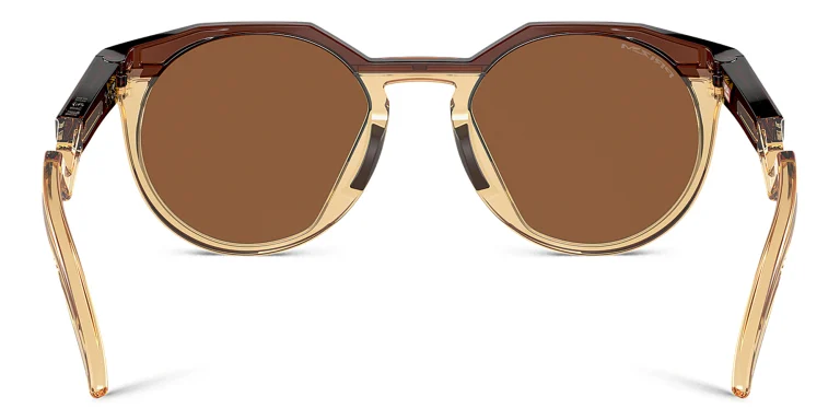 Shop Oakley HSTN Round Sunglasses in Brown online.