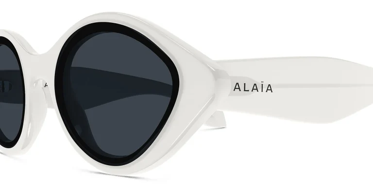 Shop ALAIA Logo Round Sunglasses in White online.