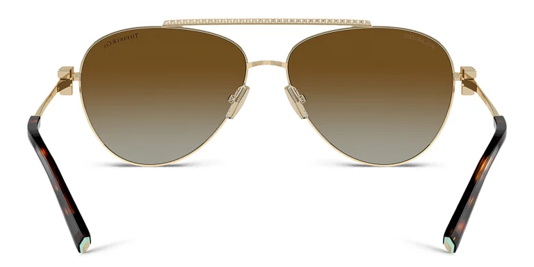 Shop TIFFANY T Motif Pilot Sunglasses in Gold online.