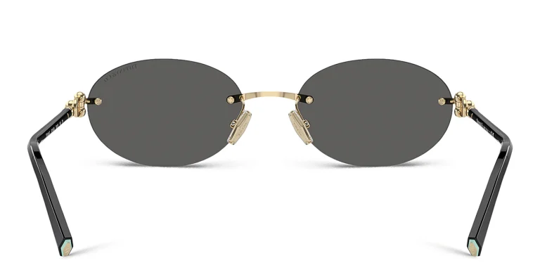 Shop TIFFANY Tiffany HardWear Rimless Oval Sunglasses in Gold online.
