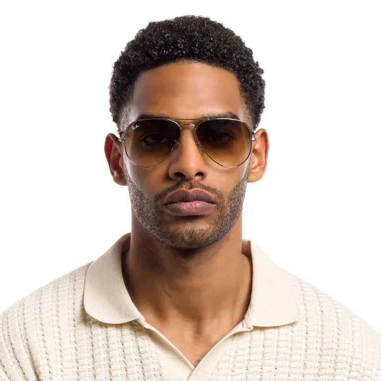 Shop Ray-Ban Pilot Gradient Sunglasses in Gold online.