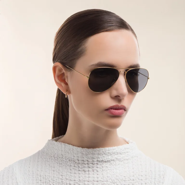 Shop Ray-Ban Unisex Pilot Polarized Sunglasses in Metal in Gold online.