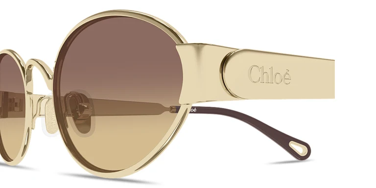 Shop Chloe Holly Oval Sunglasses in Gold online.
