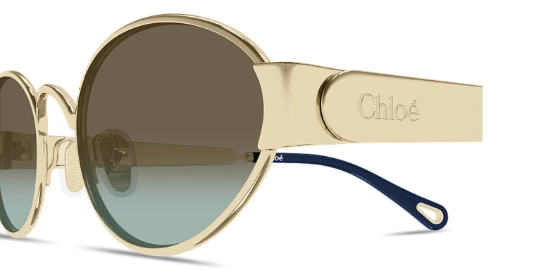 Shop Chloe Holly Oval Sunglasses in Gold online.